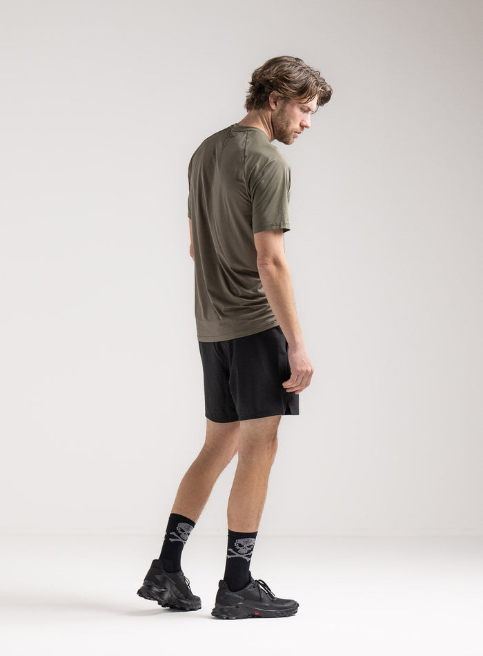 Rudie Is 6ft 2" And Wears Size: M | Hem Studio Image Of Model Wearing Force Velocity Motion T-Shirt In Khaki (SS Model)