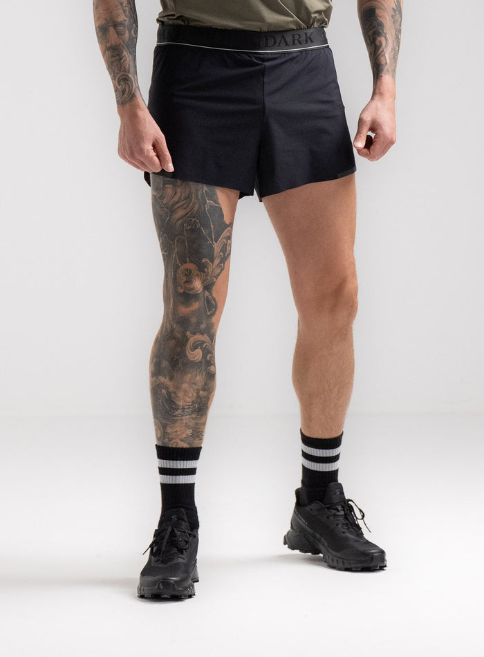 Angus Is 6ft 4" And Wears Size: L | Hem Studio Image Of Model Wearing Force Velocity Split Short In Obsidian Black (SS Model)
