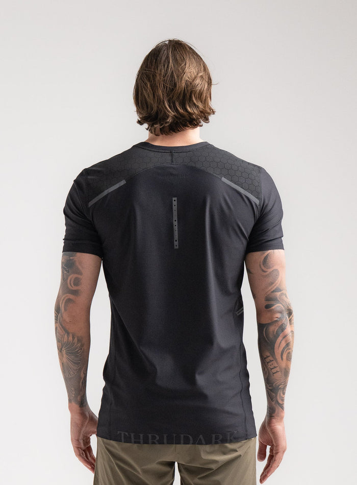 Angus Is 6ft 4" And Wears Size: L | Hem Studio Image Of Model Wearing Force Velocity Technical T-Shirt In Obsidian Black (SS Model)