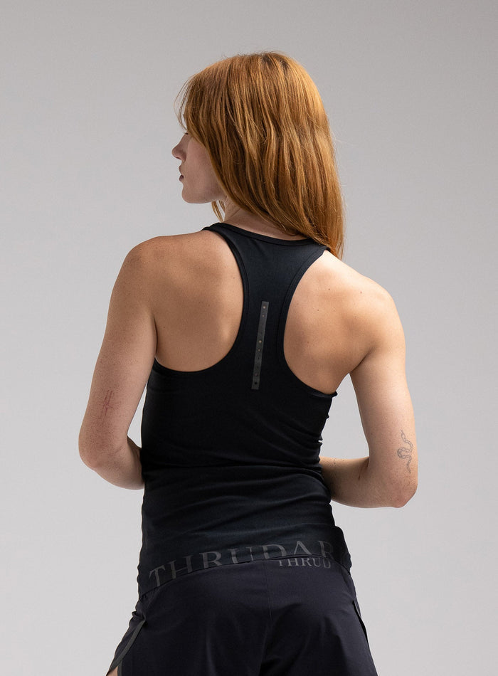 Miki Is 5ft 8" And Wears Size: S | Hem Studio Image Of Model Wearing Force Velocity Vest Womens In Obsidian Black (SS Model)