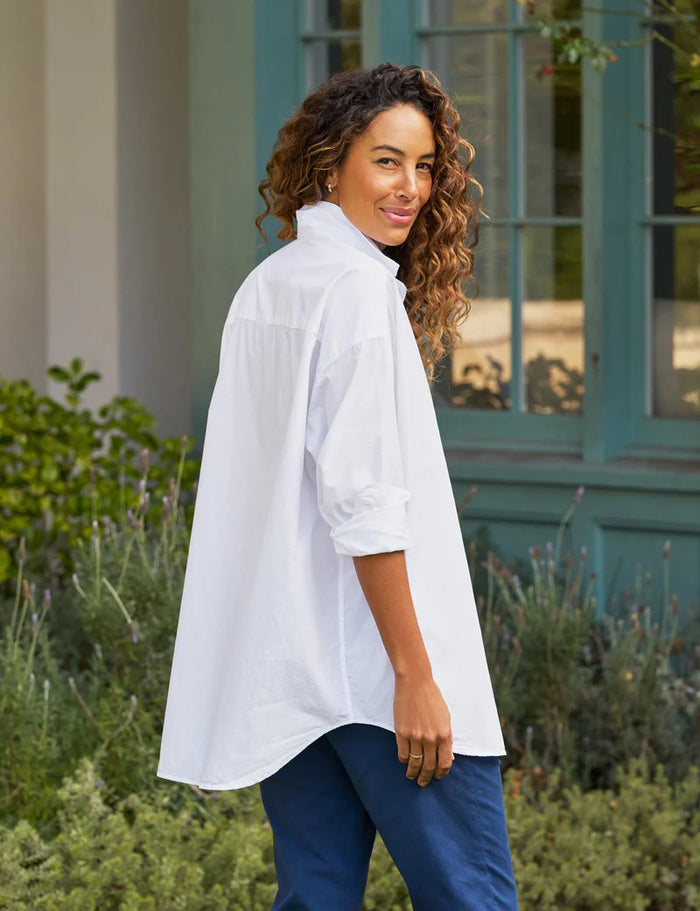 The FRANK AND EILEEN - SHIRLEY OVERSIZED BUTTON UP SHIRT features rolled long sleeves, a classic collar, a chest pocket, and an oversized fit. Made from 100% cotton poplin in classic white, the label inside is partially visible, making it ideal for casual wear.