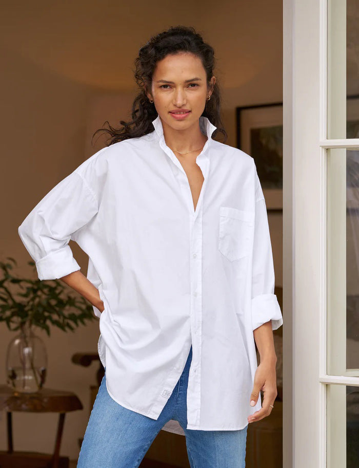 The FRANK AND EILEEN - SHIRLEY OVERSIZED BUTTON UP SHIRT features rolled long sleeves, a classic collar, a chest pocket, and an oversized fit. Made from 100% cotton poplin in classic white, the label inside is partially visible, making it ideal for casual wear.