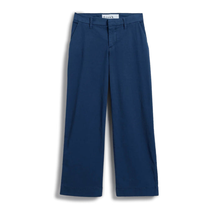 The FRANK & EILEEN Westport Italian Wide-Leg Chino in Navy is elegantly showcased against a plain white background. It features a tailored fit with side pockets and a contour waistband, neatly folded to highlight the crisp, smooth fabric, epitomizing effortless sophistication and style.