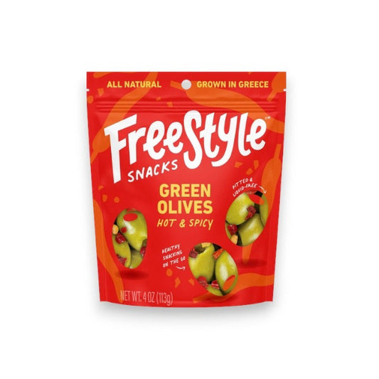A red package of FREESTYLE - HOT & SPICY GREEN OLIVES by FREESTYLE SNACKS features Calabrian chili-accented green olives. The design highlights olives, chilies, "All Natural," "Grown in Greece," and emphasizes "Healthy Snacking on the Go." Net weight: 4 oz (113g).