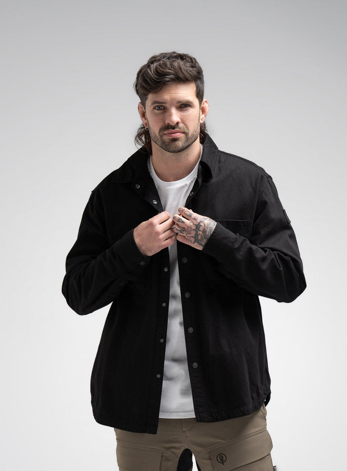 Bernie Is 6ft And Wears Size: M | Hem Studio Image Of Model Wearing Heavy Twill Overshirt In Black (SS Model)