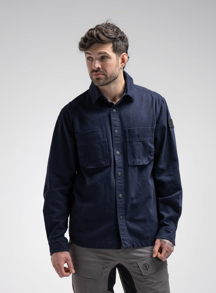 Bernie Is 6ft And Wears Size: M | Hem Studio Image Of Model Wearing Heavy Twill Overshirt In Dark Sapphire (SS Model)