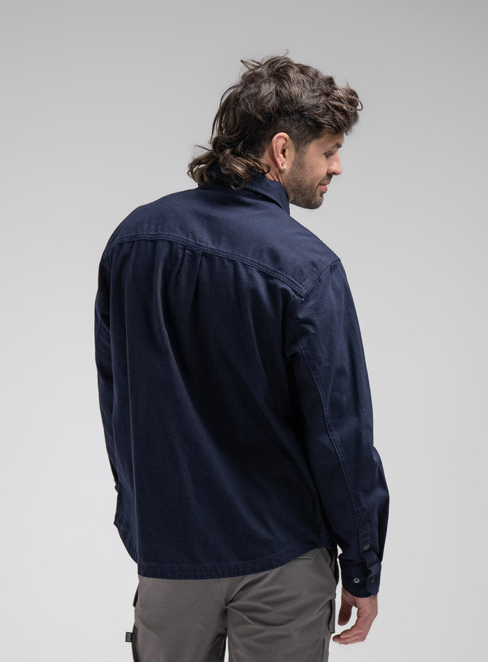 Bernie Is 6ft And Wears Size: M | Hem Studio Image Of Model Wearing Heavy Twill Overshirt In Dark Sapphire (SS Model)