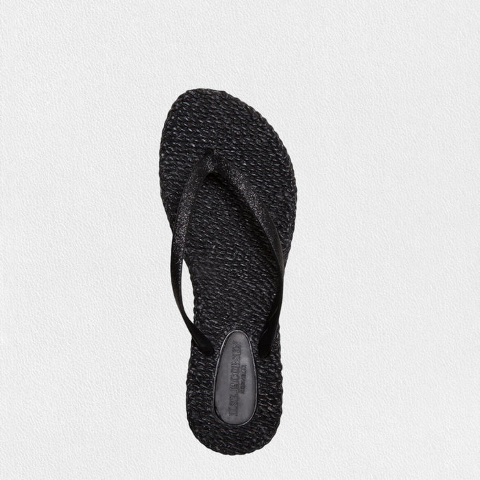 The ILSE JACOBSEN - CHEERFUL FLIP FLOP IN BLACK by LINES OF DENMARK features black braided-texture soles and simple black straps, displayed on a light textured background.