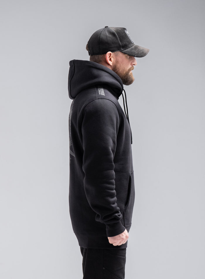 Staz Is 5ft 8" And Wears Size: S | Hem Studio Image Of Model Wearing Insignia Hoody - Thrudark X Scramble In Obsidian Black (SS Model)