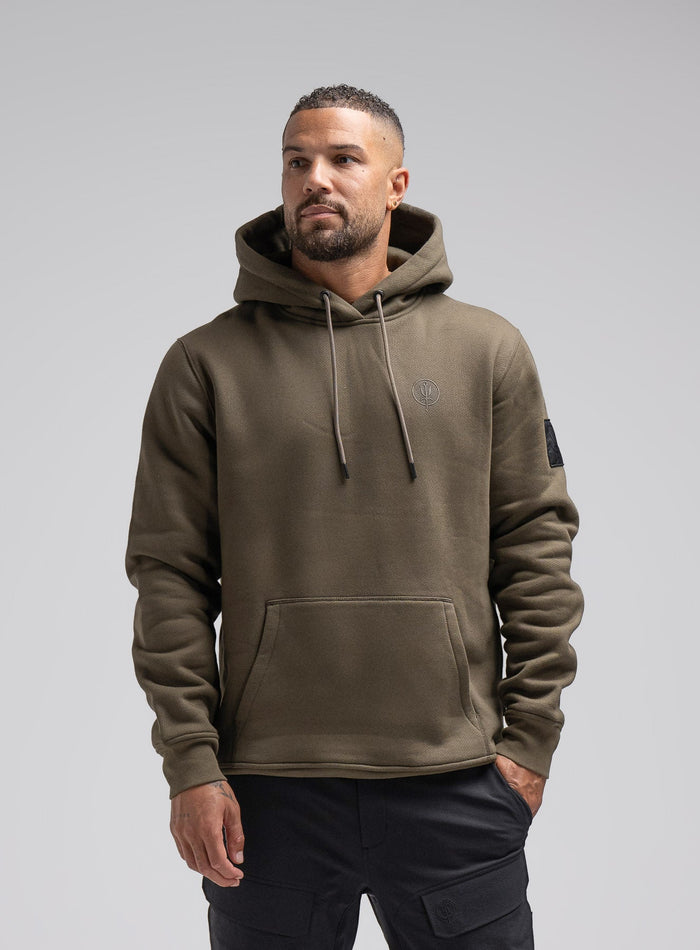 Dj Is 6ft 4" And Wears Size: Xl | Hem Studio Image Of Model Wearing Insignia Hoody In Khaki (SS Model)