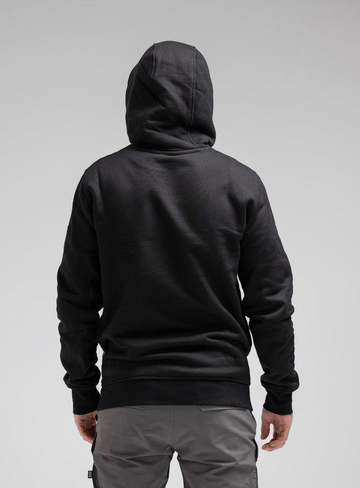 Bernie Is 6ft And Wears Size: M | Hem Studio Image Of Model Wearing Insignia Hoody In Obsidian Black (SS Model)