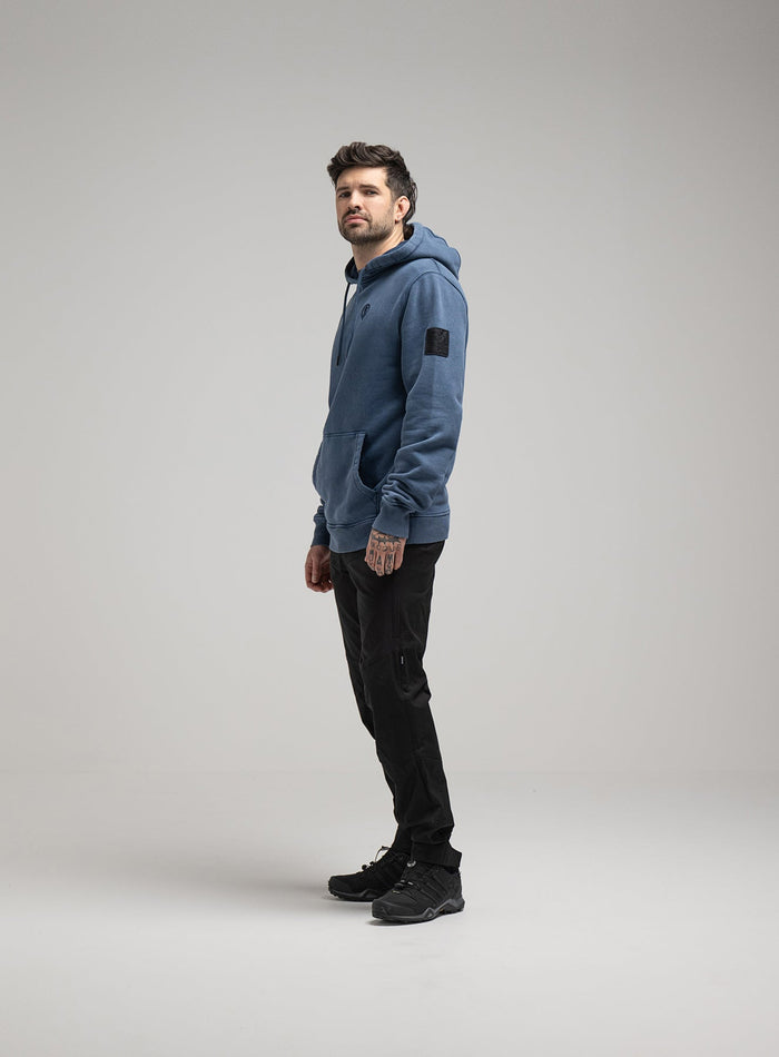 Bernie Is 6ft And Wears Size: M | Hem Studio Image Of Model Wearing Insignia Hoody Washed In Dark Sapphire (SS Model)