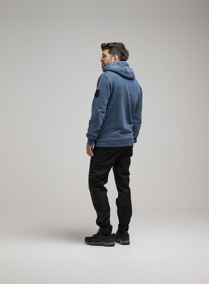 Bernie Is 6ft And Wears Size: M | Hem Studio Image Of Model Wearing Insignia Hoody Washed In Dark Sapphire (SS Model)