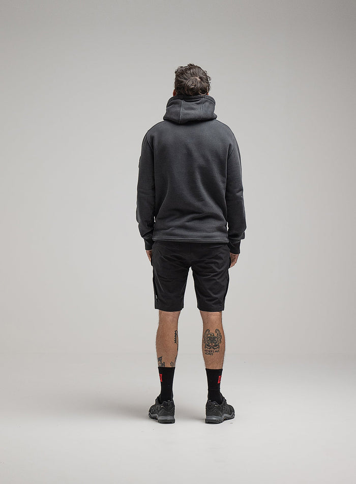 Bernie Is 6ft And Wears Size: M | Hem Studio Image Of Model Wearing Insignia Hoody Washed In Grey (SS Model)