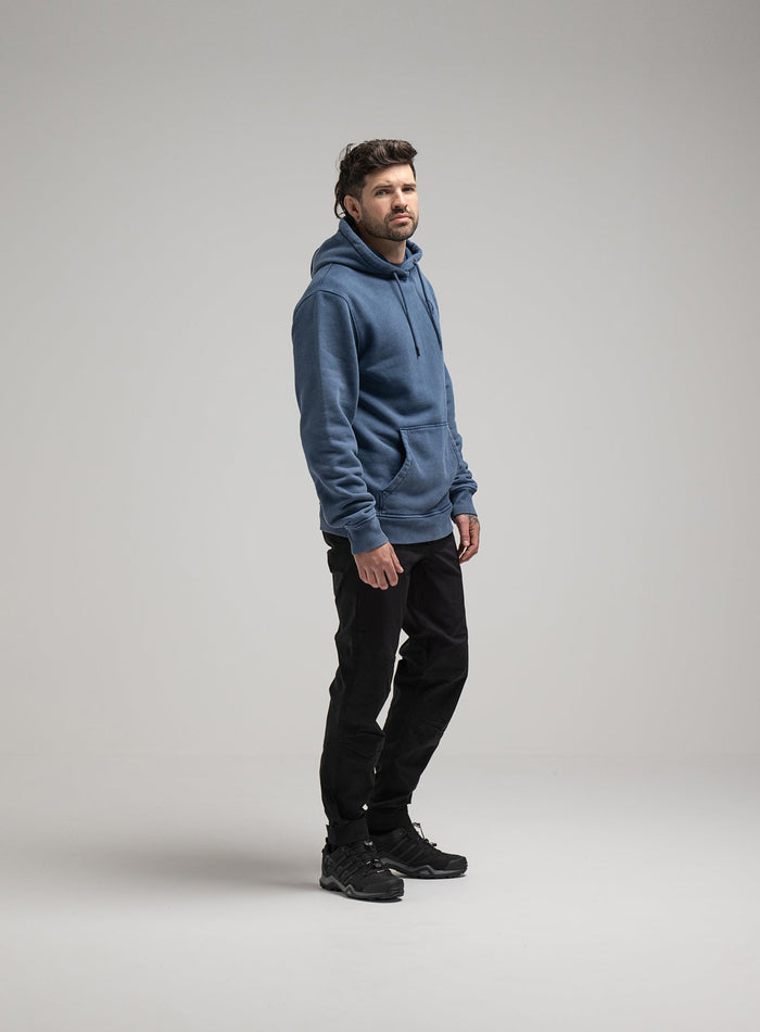 Bernie Is 6ft And Wears Size: M | Hem Studio Image Of Model Wearing Insignia Hoody Washed In Dark Sapphire (SS Model)