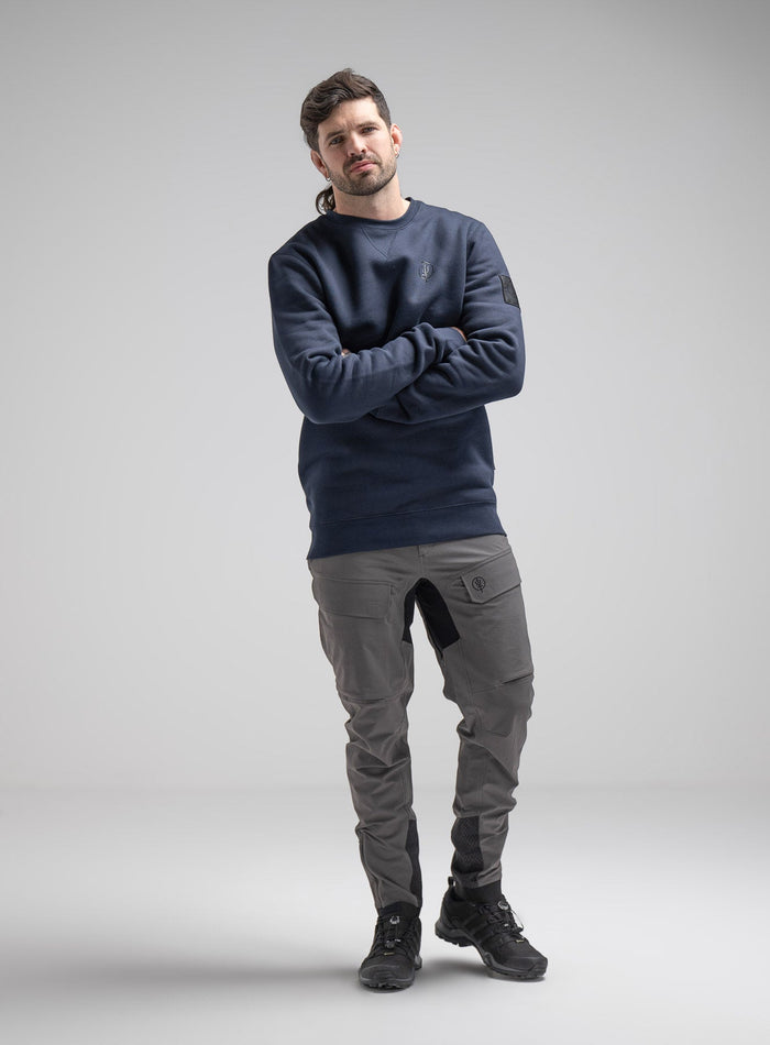 Bernie Is 6ft And Wears Size: M | Hem Studio Image Of Model Wearing Insignia Jumper In Dark Sapphire (SS Model)