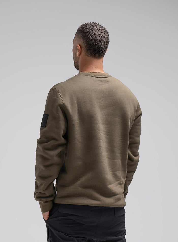 Dj Is 6ft 4" And Wears Size: Xl | Hem Studio Image Of Model Wearing Insignia Jumper In Khaki (SS Model)