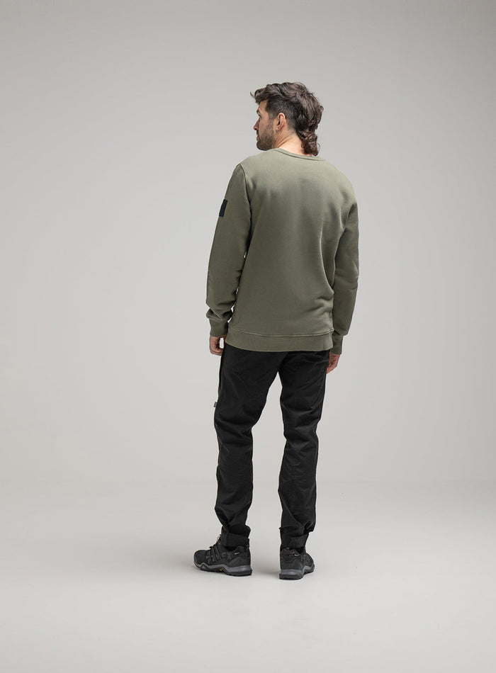 Bernie Is 6ft And Wears Size: M | Hem Studio Image Of Model Wearing Insignia Jumper Washed In Khaki (SS Model)