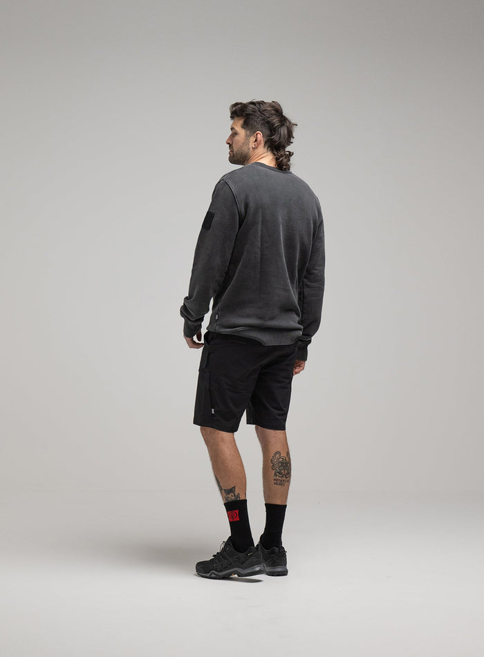 Bernie Is 6ft And Wears Size: M | Hem Studio Image Of Model Wearing Insignia Jumper Washed In Grey (SS Model)