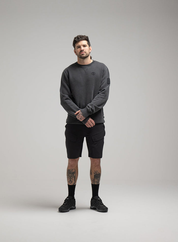 Bernie Is 6ft And Wears Size: M | Hem Studio Image Of Model Wearing Insignia Jumper Washed In Grey (SS Model)