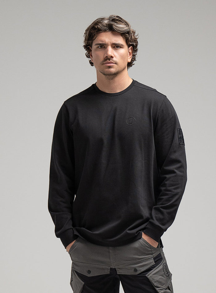 George Is 5ft 11" And Wears Size: S | Hem Studio Image Of Model Wearing Insignia Long Sleeve T-Shirt G1 In Obsidian Black (SS Model)