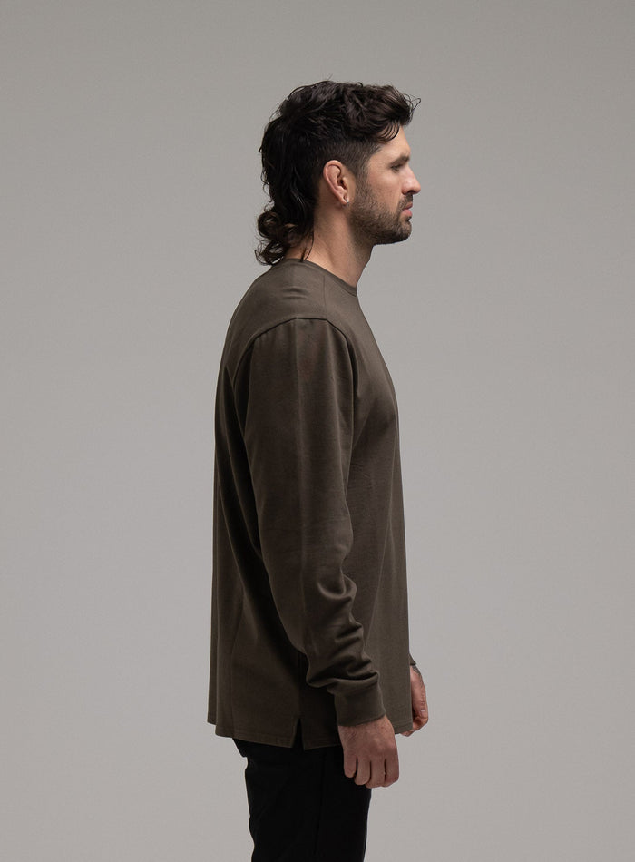 George Is 5ft 11" And Wears Size: S | Hem Studio Image Of Model Wearing Insignia Long Sleeve T-Shirt G1 In Khaki (SS Model)