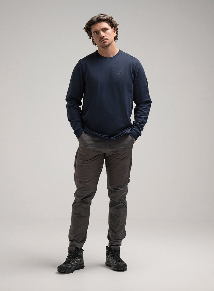 George Is 5ft 11" And Wears Size: S | Hem Studio Image Of Model Wearing Insignia Long Sleeve T-Shirt G1 In Dark Sapphire (SS Model)