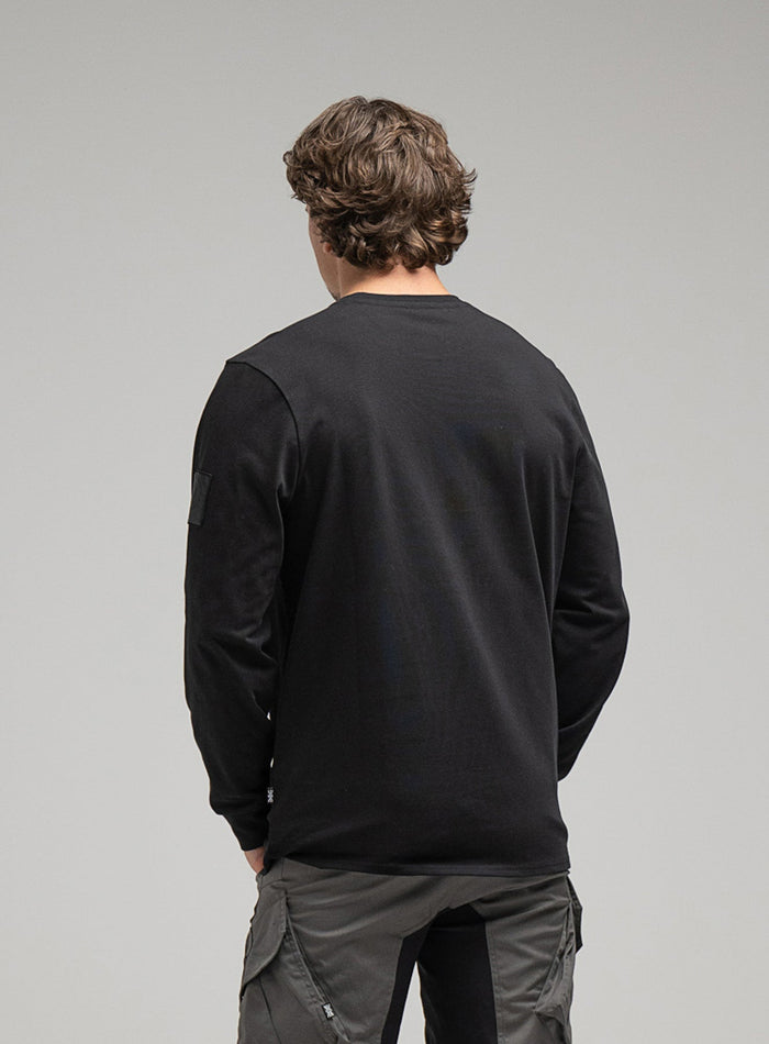 George Is 5ft 11" And Wears Size: S | Hem Studio Image Of Model Wearing Insignia Long Sleeve T-Shirt G1 In Obsidian Black (SS Model)