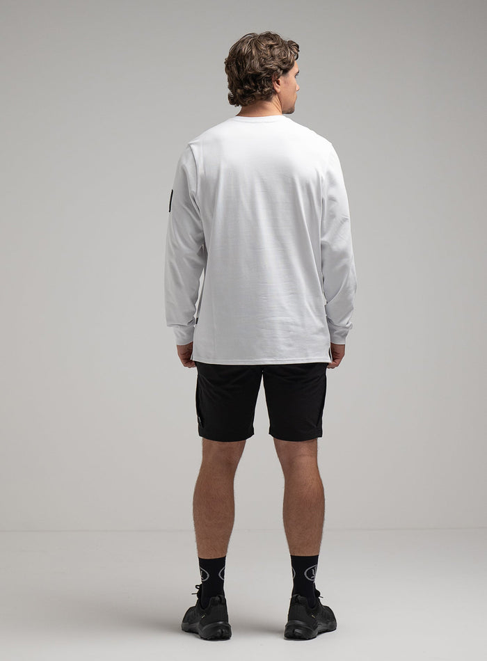 George Is 5ft 11" And Wears Size: S | Hem Studio Image Of Model Wearing Insignia Long Sleeve T-Shirt G1 In White (SS Model)
