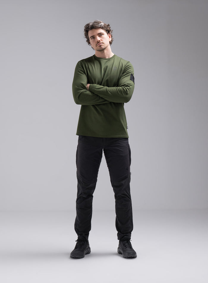 Jack Is 6ft 3" And Wears Size: L | Hem Studio Image Of Model Wearing Insignia Long Sleeve T-Shirt In Forest Green (SS Model)