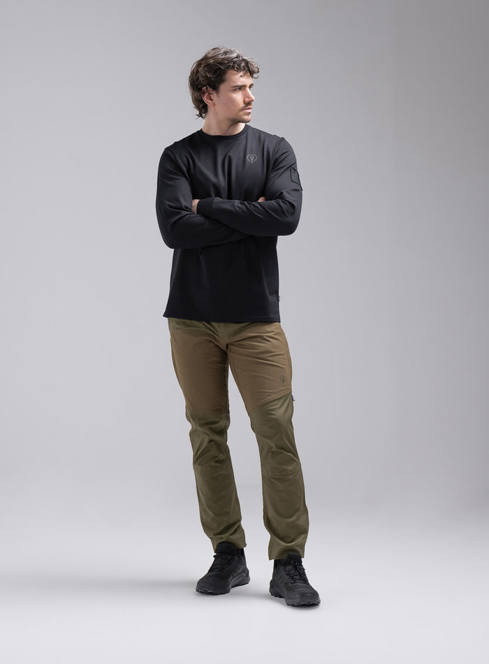 Jack Is 6ft 3" And Wears Size: L | Hem Studio Image Of Model Wearing Insignia Long Sleeve T-Shirt In Obsidian Black (SS Model)