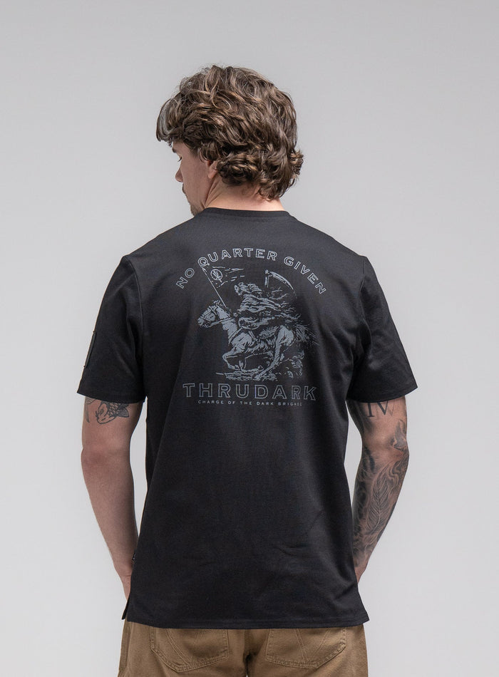 Jack Is 6ft 3" And Wears Size: L | Hem Studio Image Of Model Wearing Insignia T-Shirt - Dark Brigade In Obsidian Black (SS Model)