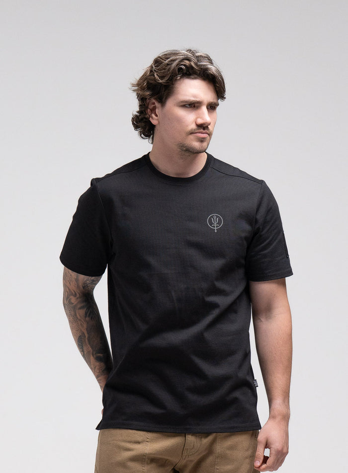Jack Is 6ft 3" And Wears Size: L | Hem Studio Image Of Model Wearing Insignia T-Shirt - Dark Brigade In Obsidian Black (SS Model)