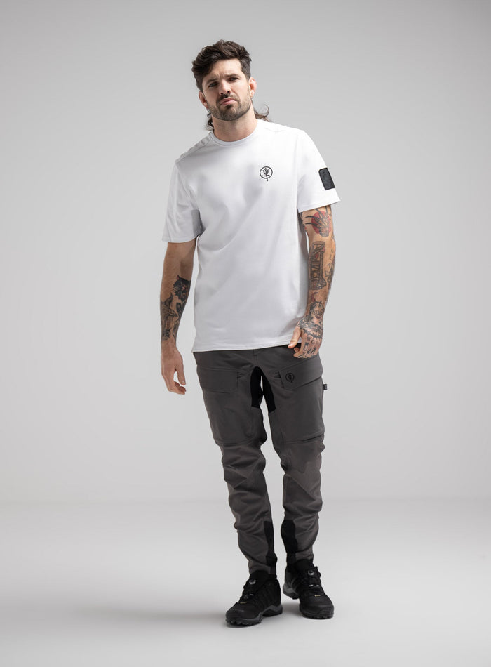 Bernie Is 6ft And Wears Size: M | Hem Studio Image Of Model Wearing Insignia T-Shirt - Good Breach In Optic White (SS Model)