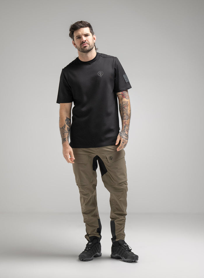 Bernie Is 6ft And Wears Size: M | Hem Studio Image Of Model Wearing Insignia T-Shirt - Good Breach In Obsidian Black (SS Model)