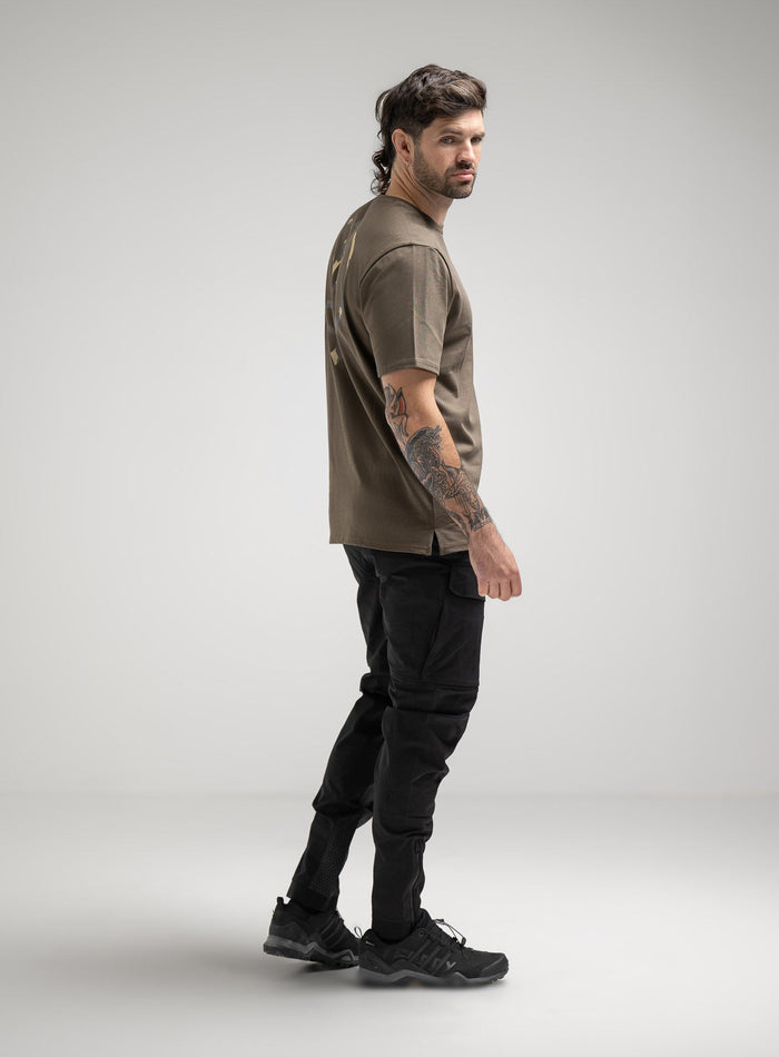 Bernie Is 6ft And Wears Size: M | Hem Studio Image Of Model Wearing Insignia T-Shirt - Inception Camo In Khaki (SS Model)