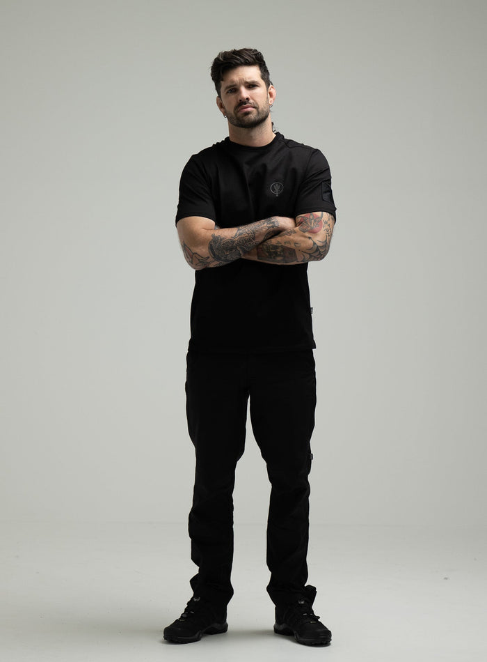 Bernie Is 6ft And Wears Size: M | Hem Studio Image Of Model Wearing Insignia T-Shirt - Wraith In Obsidian Black (SS Model)