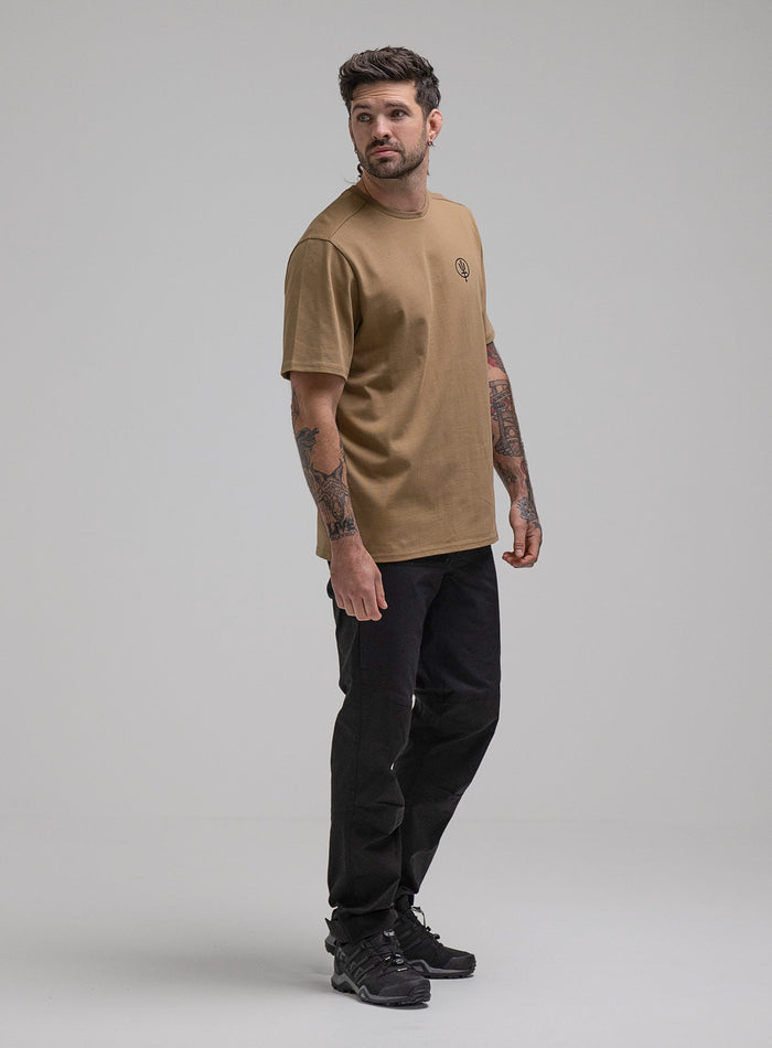 George Is 5ft 11" And Wears Size: S | Hem Studio Image Of Model Wearing Insignia T-Shirt G1 In Sand (SS Model)