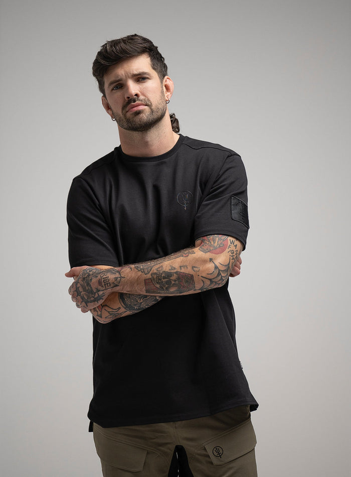 George Is 5ft 11" And Wears Size: S | Hem Studio Image Of Model Wearing Insignia T-Shirt G1 In Obsidian Black (SS Model)