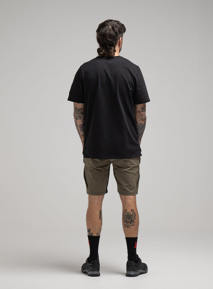 George Is 5ft 11" And Wears Size: S | Hem Studio Image Of Model Wearing Insignia T-Shirt G1 In Obsidian Black (SS Model)
