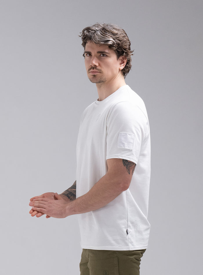 Jack Is 6ft 3" And Wears Size: L | Hem Studio Image Of Model Wearing Insignia Short Sleeve T-Shirt In Optic White (SS Model)