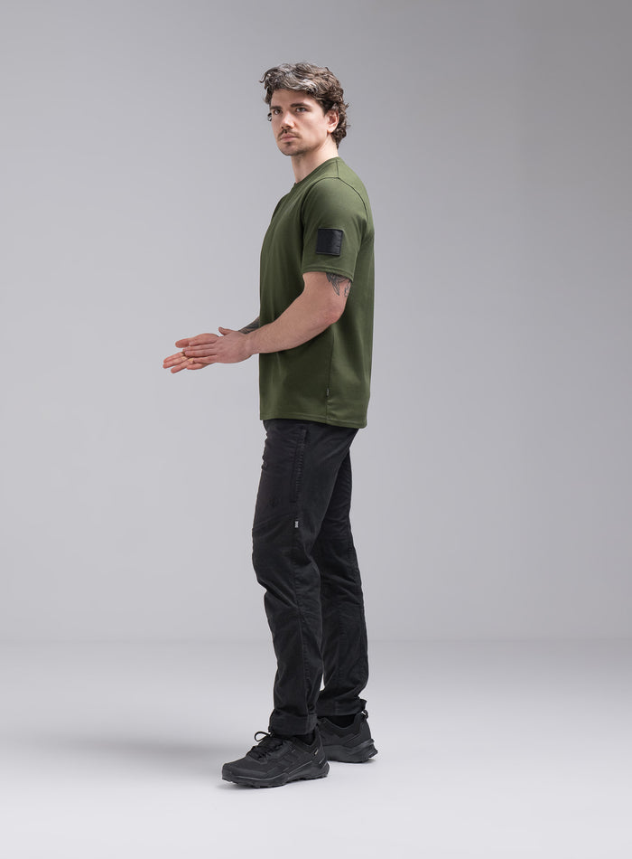Jack Is 6ft 3" And Wears Size: L | Hem Studio Image Of Model Wearing Insignia Short Sleeve T-Shirt In Forest Green (SS Model)
