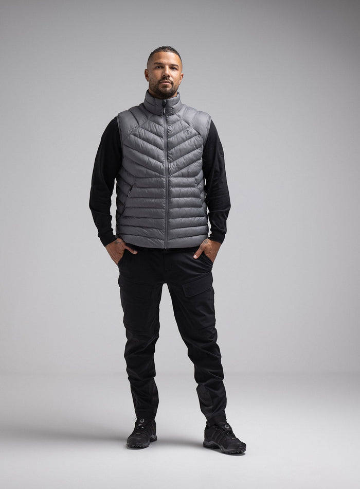 Dj Is 6ft 4" And Wears Size: Xl | Hem Studio Image Of Model Wearing Ithax Gilet In Wolf Grey (SS Model)