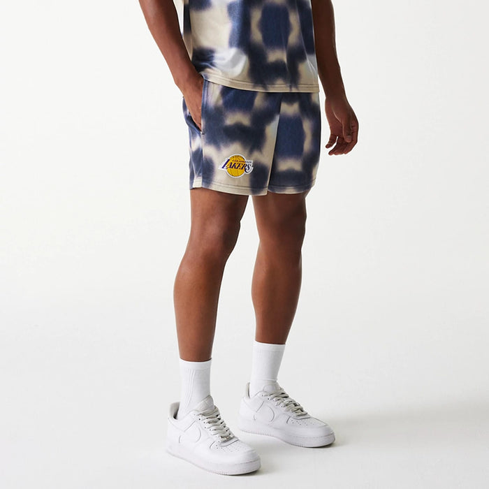 The Male model is wearing LA Lakers NBA All Over Print Cream Shorts 3