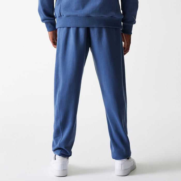 The Male model is wearing LA Lakers NBA Arch Graphic Dark Blue Joggers 2