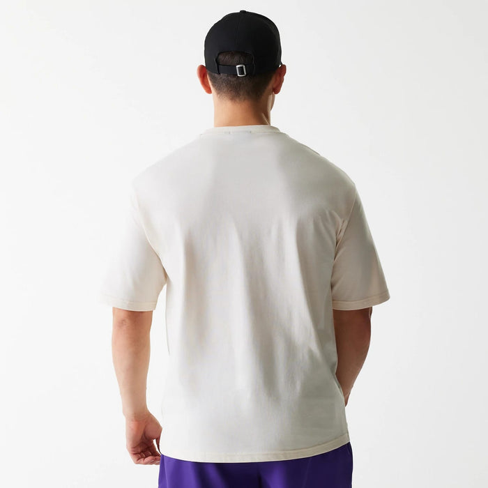 The Male model is wearing LA Lakers NBA Graphic Light Beige Oversized T-Shirt 2