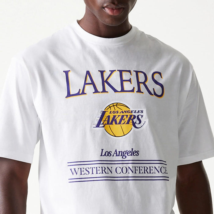 The Male model is wearing LA Lakers NBA Team Graphic White Oversized T-Shirt 4