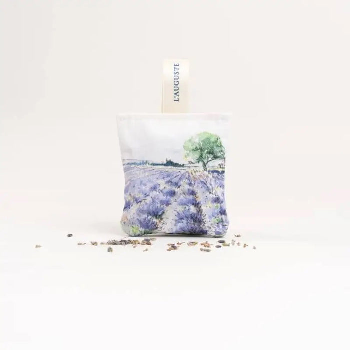 L'AUGUSTE PROVENCE - FRENCH LAVENDER SACHET AND GIFT BOX: includes two organic sachets with watercolor lavender field designs, "L'AUGUSTE" fabric tags, all elegantly presented in a box labeled “Fabriqué en Provence, FRANCE.”.