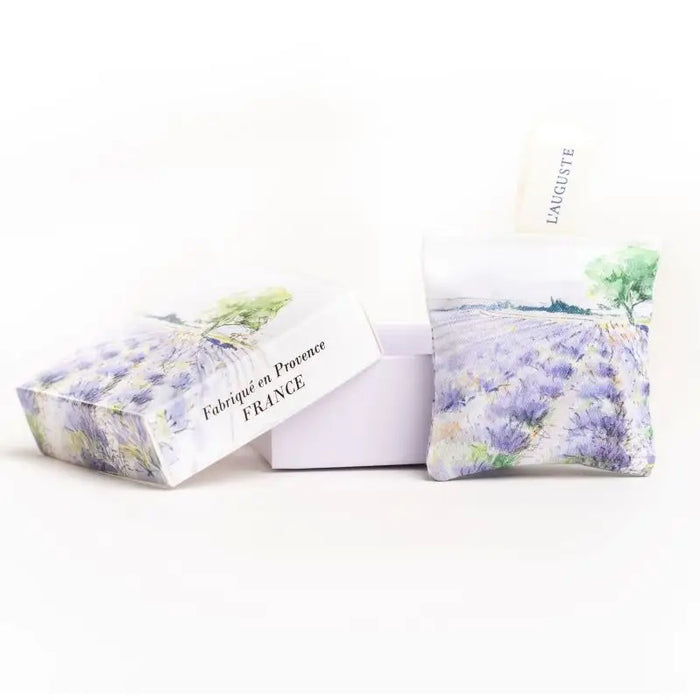 L'AUGUSTE PROVENCE - FRENCH LAVENDER SACHET AND GIFT BOX: includes two organic sachets with watercolor lavender field designs, "L'AUGUSTE" fabric tags, all elegantly presented in a box labeled “Fabriqué en Provence, FRANCE.”.