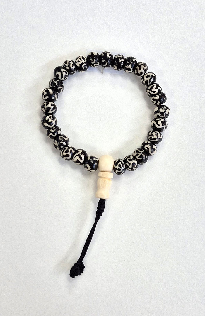 Mala Bracelet - Tibetan Yak Bone Dark with Mantra and White Guru Bead